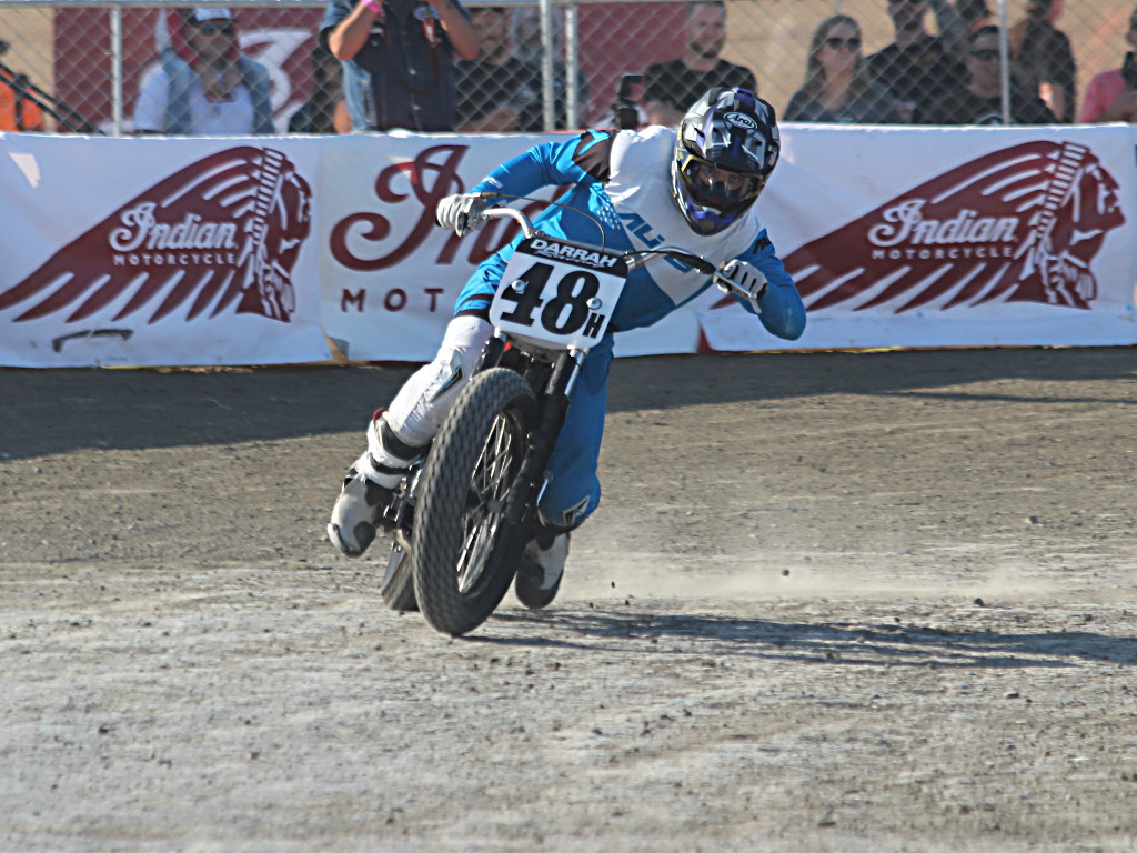 flat track racing motorcycle exits a corner