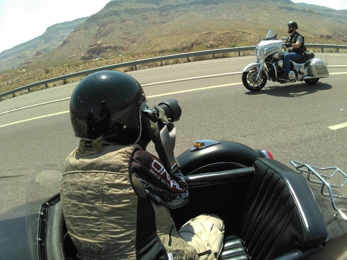 Sara Liberte shoots photos from a moving sidecar