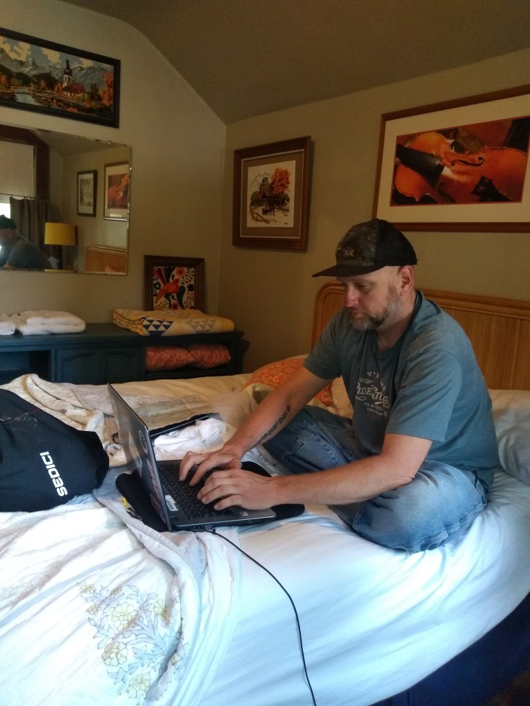 man writing laptop computer