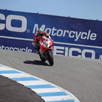 laguna seca corkscrew corner race track with ducati superbike motorcycle turning