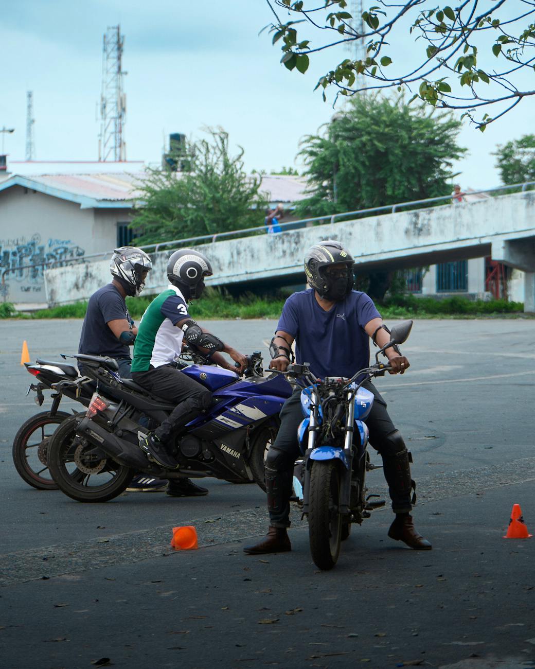 stock picture of motorcycle riders doing parking lot training