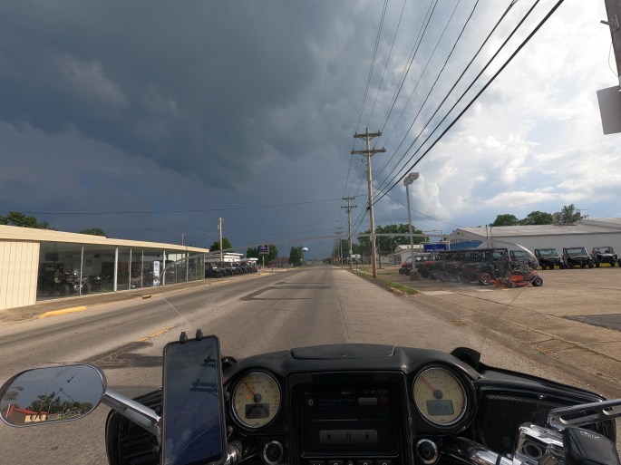 POV of motorcycle riding into stormy weather