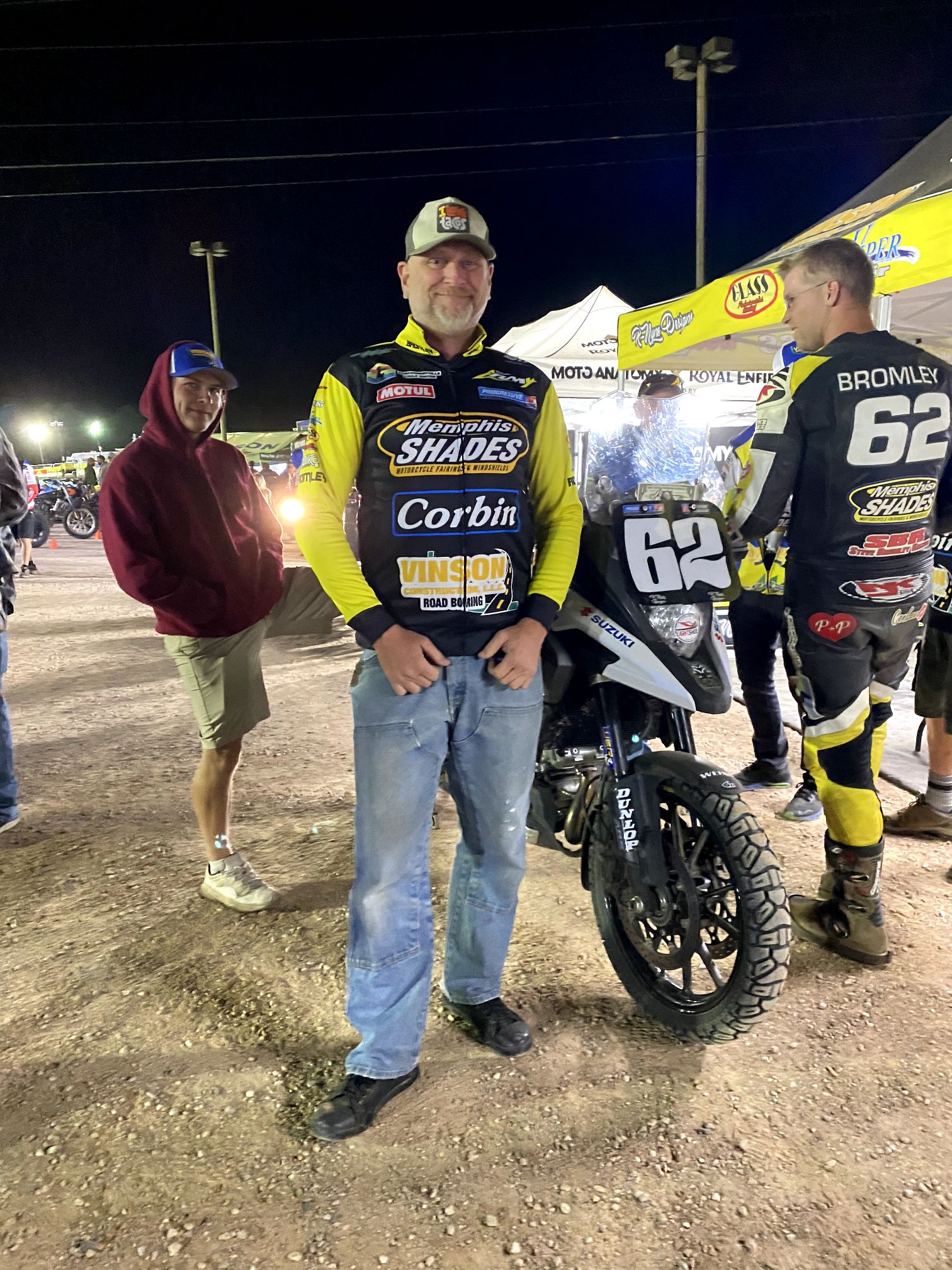 Mechanic John Wood standing in front of a flat track racing motorcycle